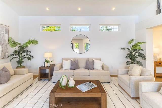 living room featuring recessed lighting and baseboards