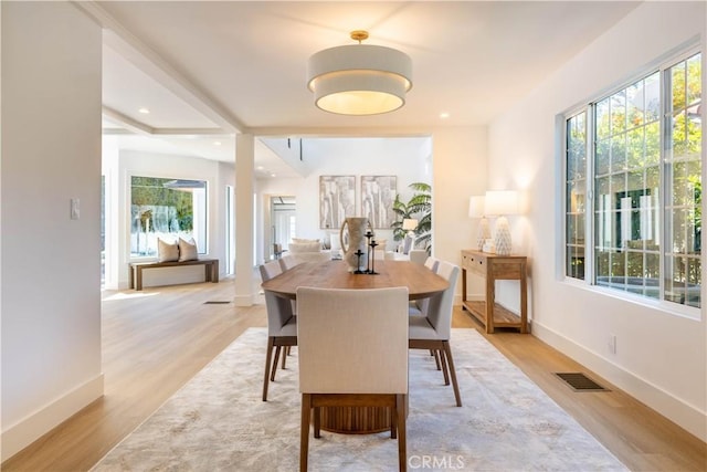 dining room featuring recessed lighting, baseboards, visible vents, and light wood finished floors