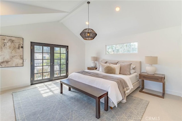 bedroom with lofted ceiling with beams, french doors, carpet floors, and multiple windows