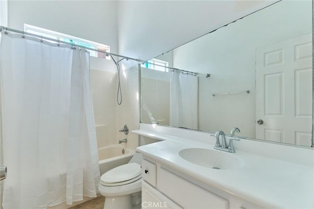 bathroom with toilet, shower / bath combo with shower curtain, and vanity