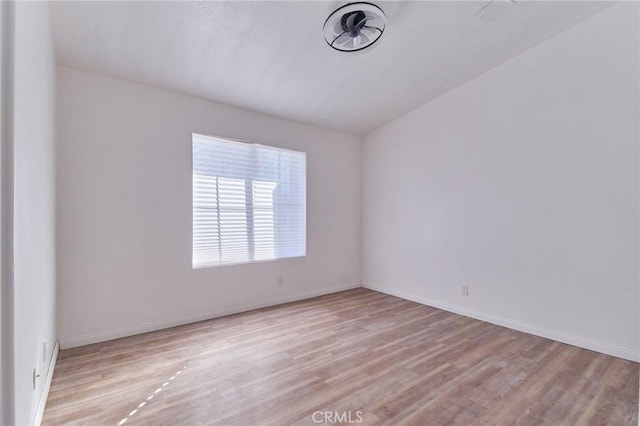 unfurnished room featuring light wood-style floors and baseboards