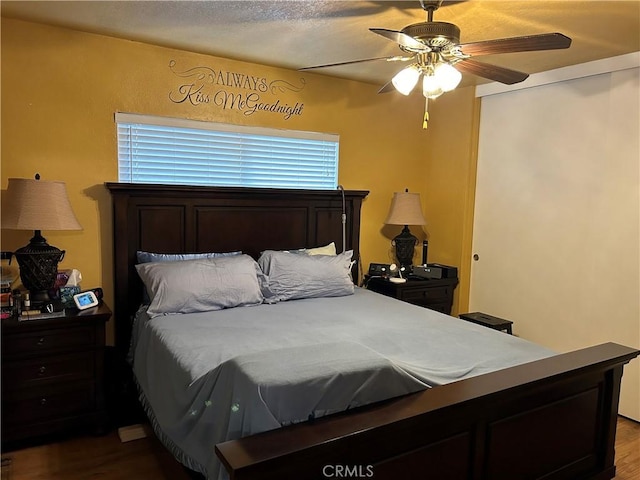 bedroom featuring ceiling fan and wood finished floors