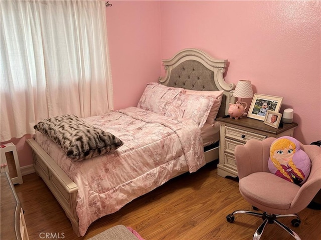 bedroom featuring light wood-type flooring