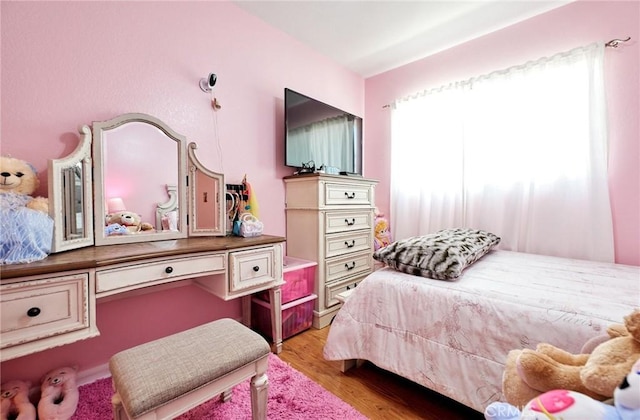 bedroom featuring light wood finished floors