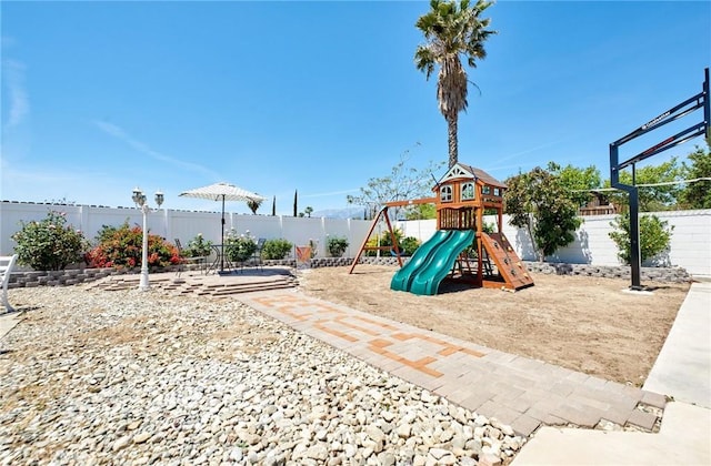 view of jungle gym with a fenced backyard