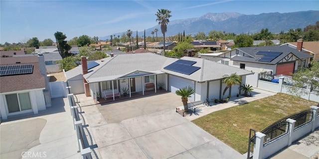 aerial view featuring a mountain view and a residential view