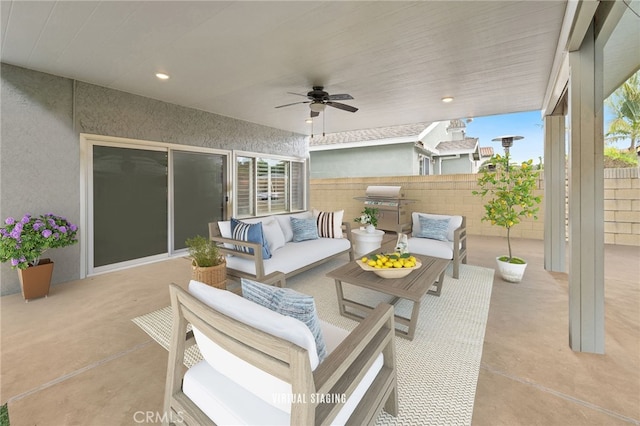 view of patio featuring a grill, ceiling fan, fence, and an outdoor hangout area