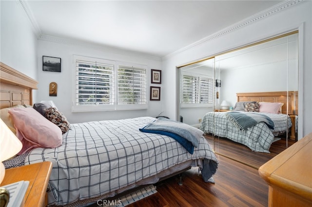 bedroom with dark wood-type flooring and crown molding