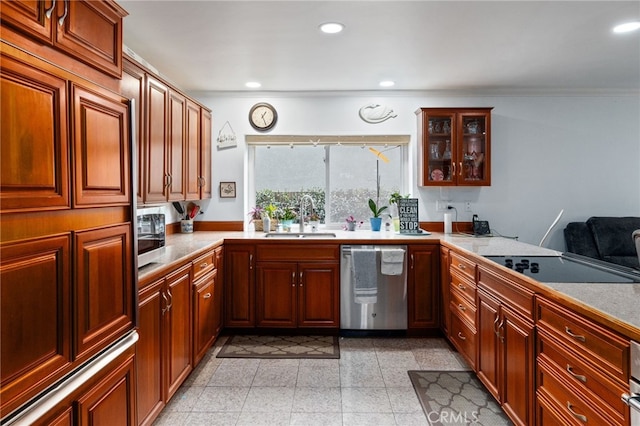 kitchen featuring recessed lighting, light countertops, dishwasher, and a sink