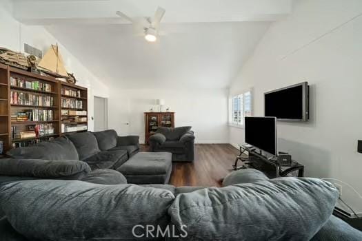 living room with ceiling fan, lofted ceiling with beams, baseboards, and wood finished floors