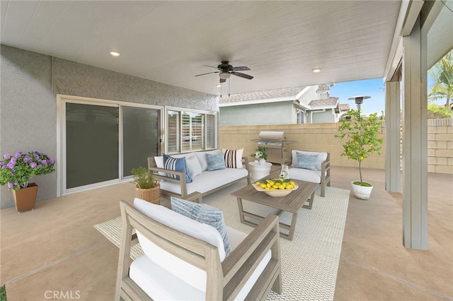 view of patio / terrace with a ceiling fan, fence, area for grilling, and an outdoor hangout area