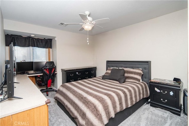 carpeted bedroom with visible vents and a ceiling fan