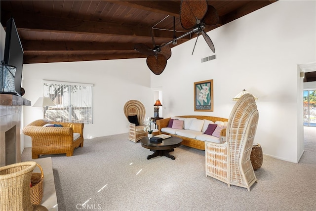 carpeted living room with wooden ceiling, a fireplace, visible vents, and a wealth of natural light