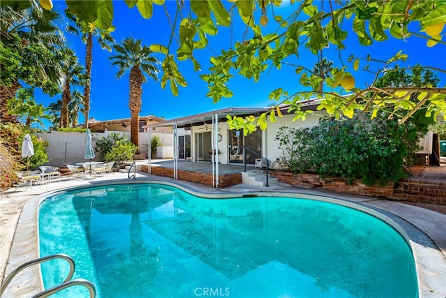 view of pool featuring a patio, fence, and a fenced in pool