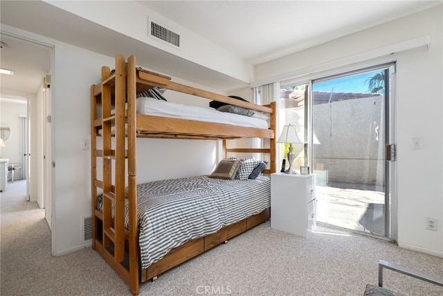 bedroom with light carpet, access to outside, visible vents, and baseboards