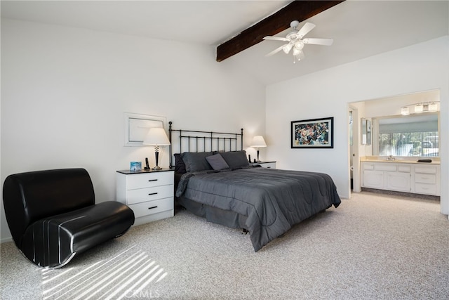 bedroom featuring lofted ceiling with beams, ensuite bath, a ceiling fan, and light colored carpet