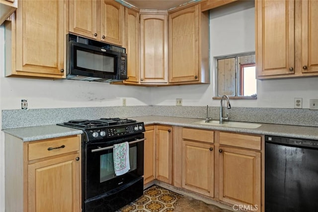 kitchen featuring a sink, light countertops, black appliances, and light brown cabinetry