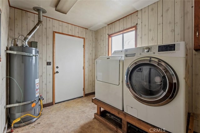 laundry area with washer and dryer, laundry area, and water heater