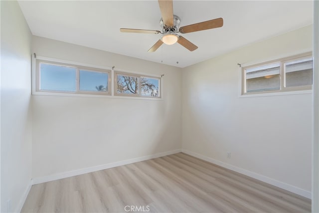 unfurnished room with light wood-type flooring, baseboards, and ceiling fan