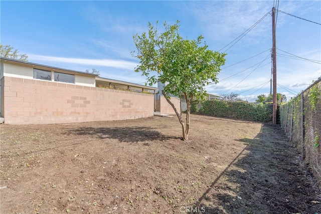 view of yard with a fenced backyard