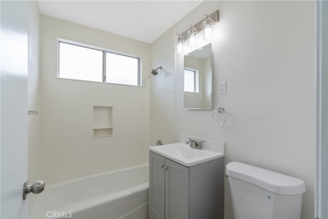 bathroom featuring vanity,  shower combination, and toilet