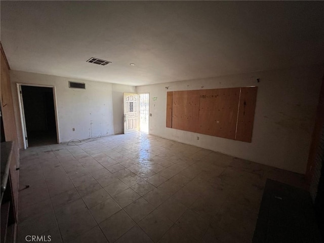 spare room featuring visible vents