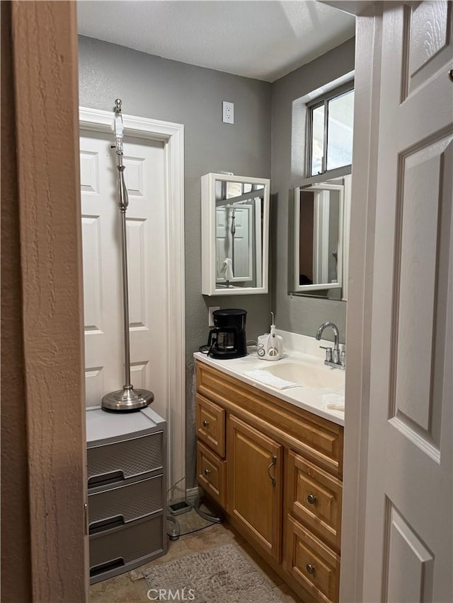 bathroom with vanity and tile patterned floors