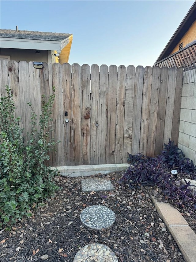 exterior details with a gate and fence