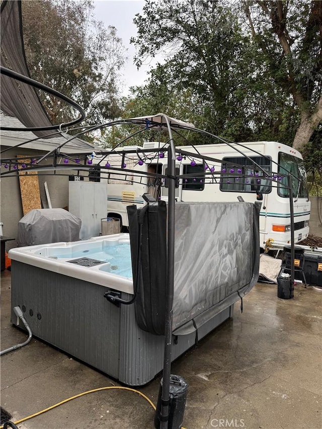 exterior space featuring a hot tub