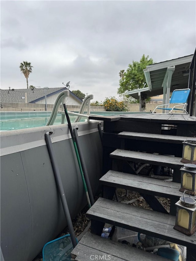 exterior details with fence and a pool