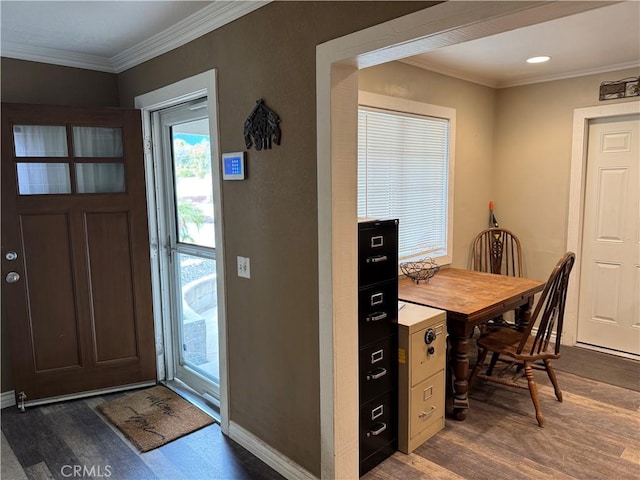 interior space with baseboards, ornamental molding, and dark wood-type flooring