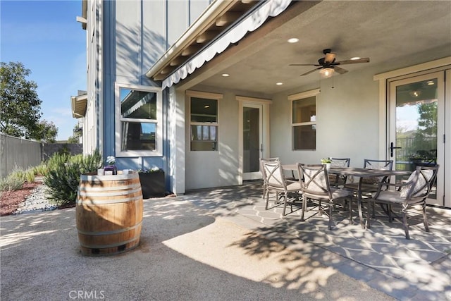 view of patio / terrace with outdoor dining space and fence