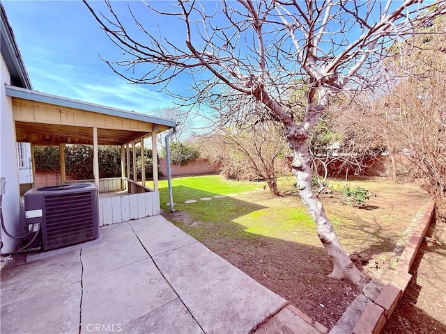 exterior space with central AC, a patio, and a fenced backyard