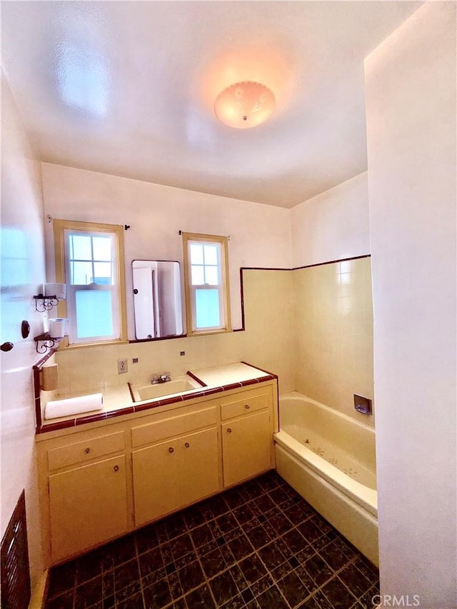 bathroom with a sink and a bath