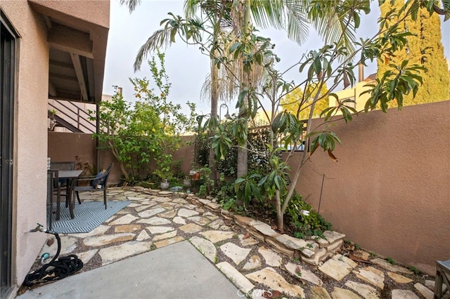 view of patio / terrace with outdoor dining area and a fenced backyard