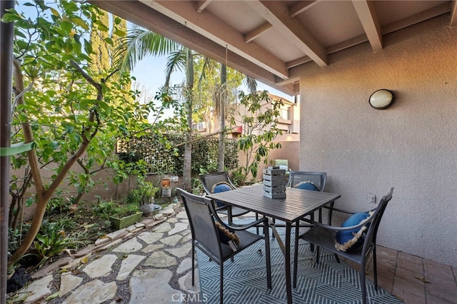 view of patio with outdoor dining area and a fenced backyard