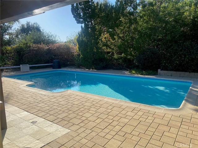 outdoor pool with a patio