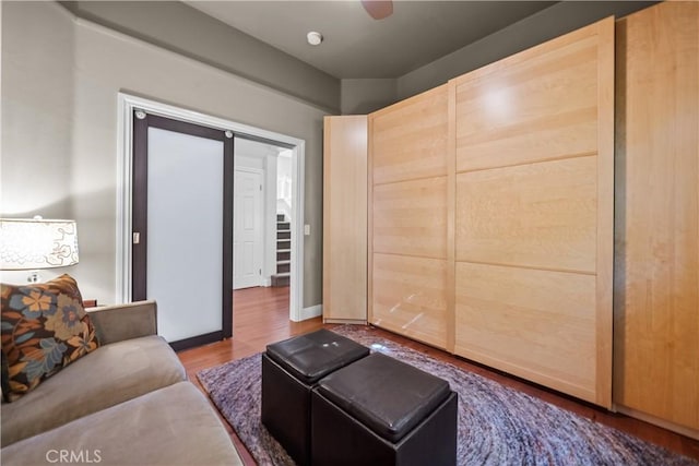 living room featuring baseboards and wood finished floors