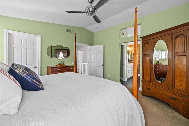 carpeted bedroom with lofted ceiling, visible vents, and a ceiling fan