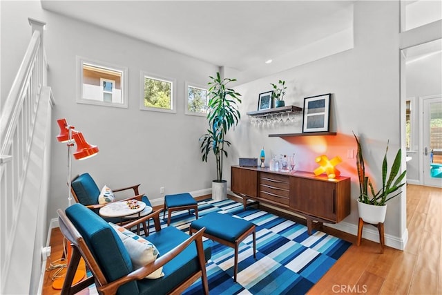 living area featuring wood finished floors and baseboards