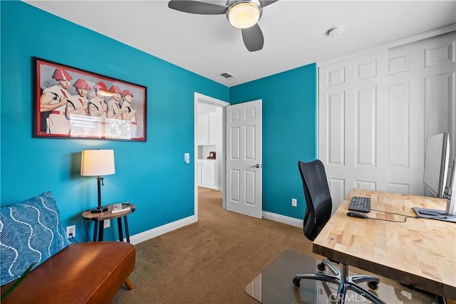 office with carpet, visible vents, baseboards, and ceiling fan