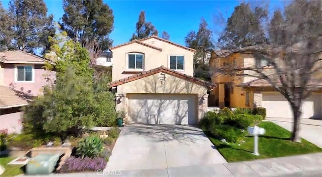 mediterranean / spanish home with a garage, a tile roof, concrete driveway, and stucco siding