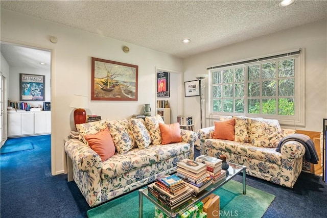 carpeted living room featuring a textured ceiling and recessed lighting