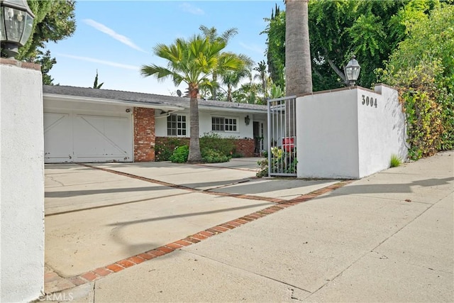 view of front of home featuring a garage and concrete driveway