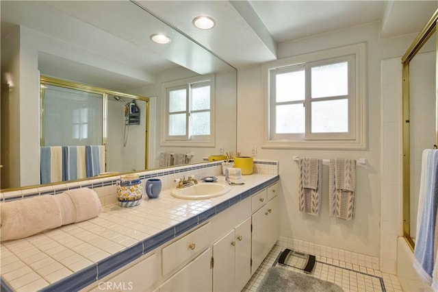 bathroom featuring tile patterned flooring, shower / bath combination with glass door, vanity, and recessed lighting