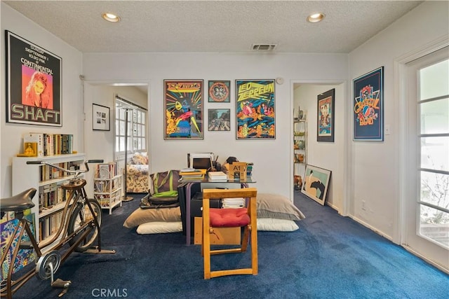 rec room with a healthy amount of sunlight, visible vents, a textured ceiling, and recessed lighting