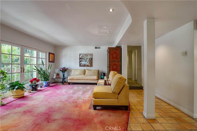 living room featuring light tile patterned floors, baseboards, visible vents, and recessed lighting