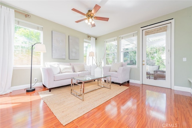 interior space with wood finished floors and baseboards