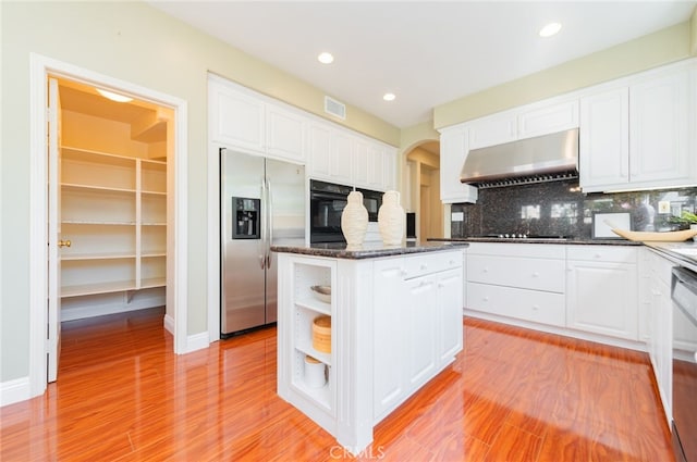 kitchen with open shelves, exhaust hood, visible vents, white cabinets, and black appliances