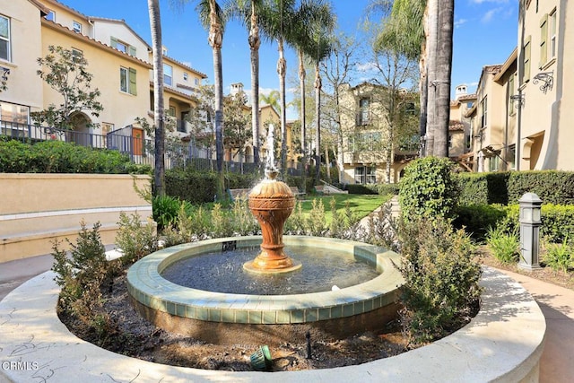 surrounding community with a residential view and fence